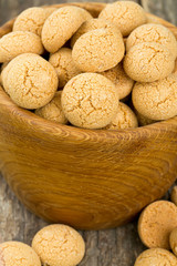 Traditional italian almond cookies - amaretti, on wooden surface