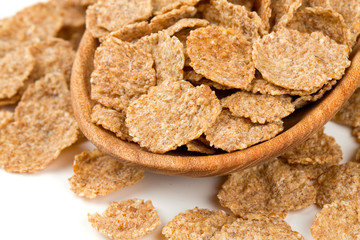 pile of bran flakes isolated on white