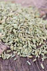 fennel seeds on wooden surface