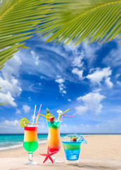 Fresh tropical cocktail on sunny beach in Maldives