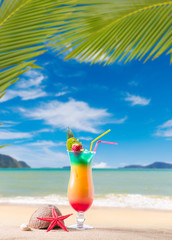 Fresh tropical cocktail on sunny beach in Maldives