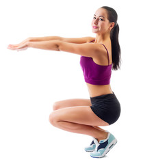 Fototapeta premium Young sporty woman doing gymnastic exercises