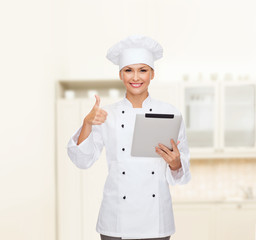 smiling female chef with tablet pc computer