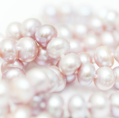 string of pearls delicate pink color, defocused image