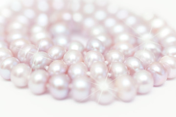 string of pearls delicate pink color, defocused image