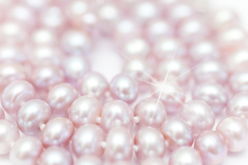 string of pearls delicate pink color, defocused image