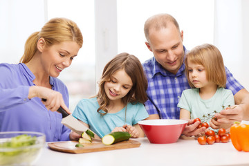 happy family with two kids making dinner at home