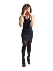 Fototapeta premium Adult girl shouting over isolated white background