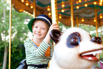 kid at the merry-go-round