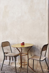 A Table And Chairs On the stereet