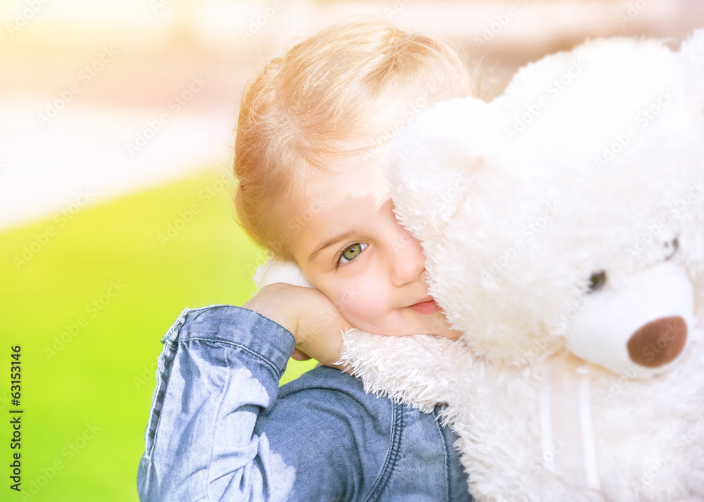 Wall mural Happy girl with soft toy