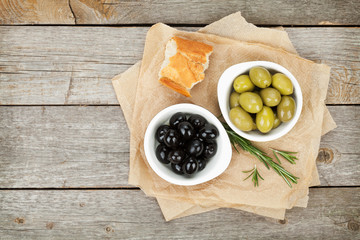 Italian food appetizer of olives, bread and herbs