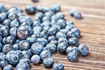 blueberries on old wooden table background
