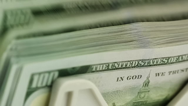 US Dollars in Counting Machine