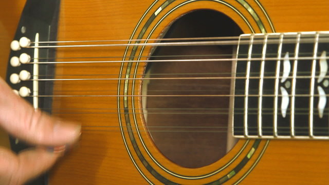 Musical instrument with guitarist hands