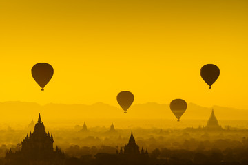 Balloon over plain of Bagan in misty morning, Myanmar