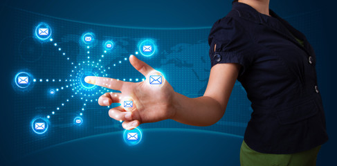 Woman pressing virtual messaging type of icons