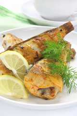 Fried fish with lemon and dill