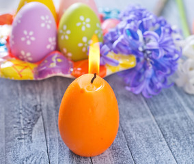 Obraz na płótnie Canvas easter eggs and candle