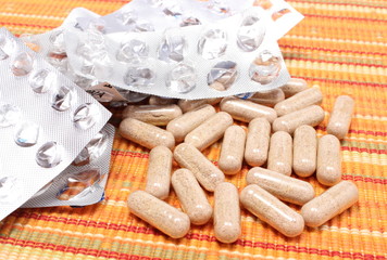 Heap of tablets and empty pills blisters