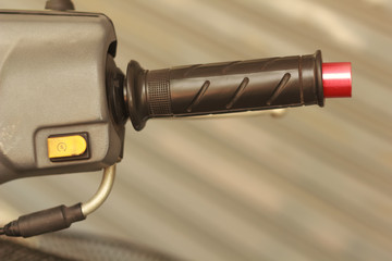 Engine start switch for electric motorcycle.