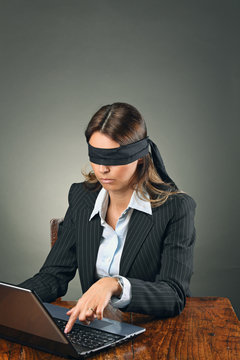 Blindfolded Business Woman With Laptop