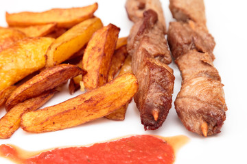 Pork skewers and French fries