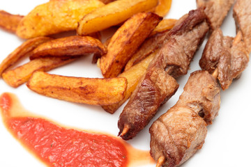 Pork skewers and French fries