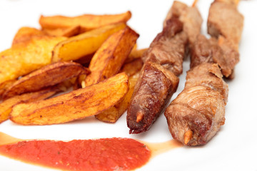 Pork skewers and French fries