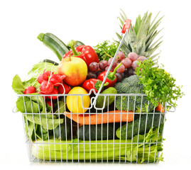 Wire shopping basket with groceries isolated on white © monticellllo