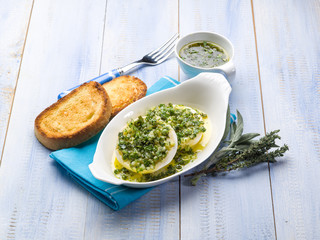 marinated tomino cheese with herbs