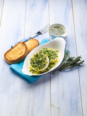 marinated tomino cheese with herbs