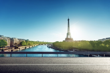 Fototapeta na wymiar Eiffel Tower and road in sunrise time