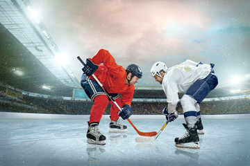 Ice hockey player on the ice. Open stadium - Winter Classic game