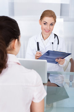 Female Doctor Talking With Patient