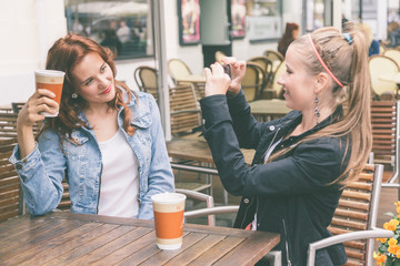 Girls Taking Pictures with Mobile Phone