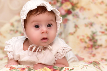 Cute little girl in dress and hat