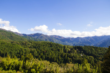 Fototapeta na wymiar Blue sky green mountain