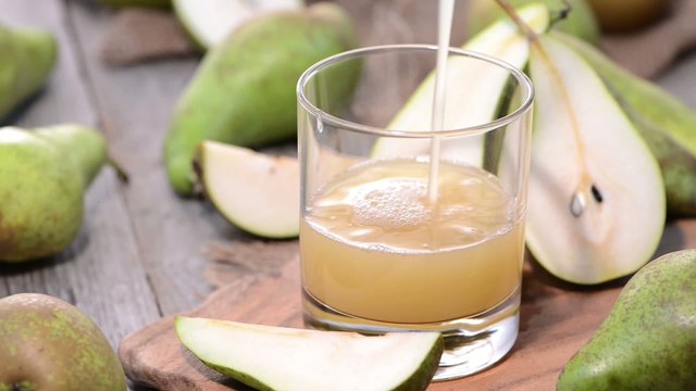 Filling Pear Juice in a glass