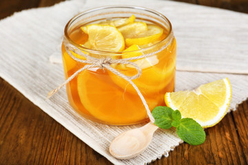 Fototapeta premium Tasty lemon jam on table close-up
