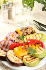 Delicious grilled vegetables on plate on table close-up