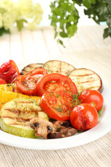 Delicious grilled vegetables on plate on table close-up