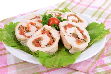 Delicious chicken roll on plate on table close-up