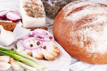 Rye bread with lard and onion on table close up