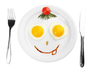 Scrambled eggs with bread on plate, on color napkin