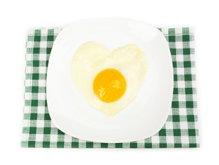 Scrambled eggs with bread on plate, on color napkin