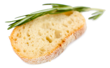 Fresh bread and rosemary isolated on white