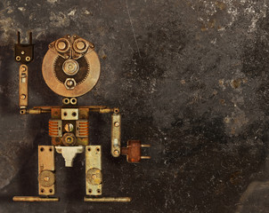Obraz na płótnie Canvas Robot z metalowych części na ciemnym tle grungy