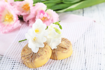 Composition with beautiful  flowers and soap