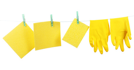 Kitchen sponges and rubber gloves hanging